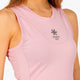 Woman wearing the Osaka women floucy dress pink with logo in grey. Front detail logo view