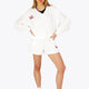Woman wearing the Osaka women v-neck cropped sweater white with logo in red. Front view