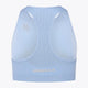 Osaka women tech sports bra in manor blue with logo in grey. Back flatlay view
