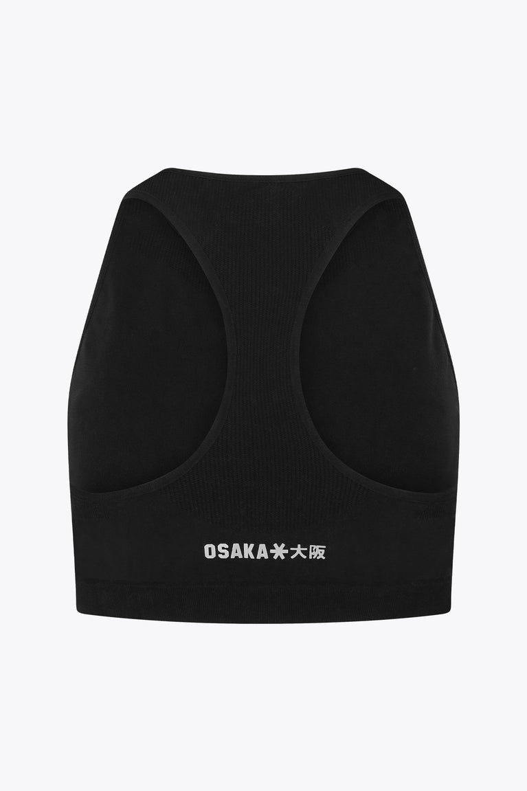 Osaka women tech sports bra in black with logo in grey. Back flatlay view