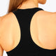 Woman wearing the Osaka women tech sports bra in black with logo in grey. Back detail view