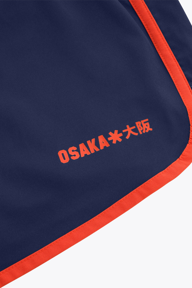 Women’s court shorts in navy with orange trim and Osaka logo