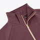 Plum zip-up sweater close-up with stand collar and gold zipper trim