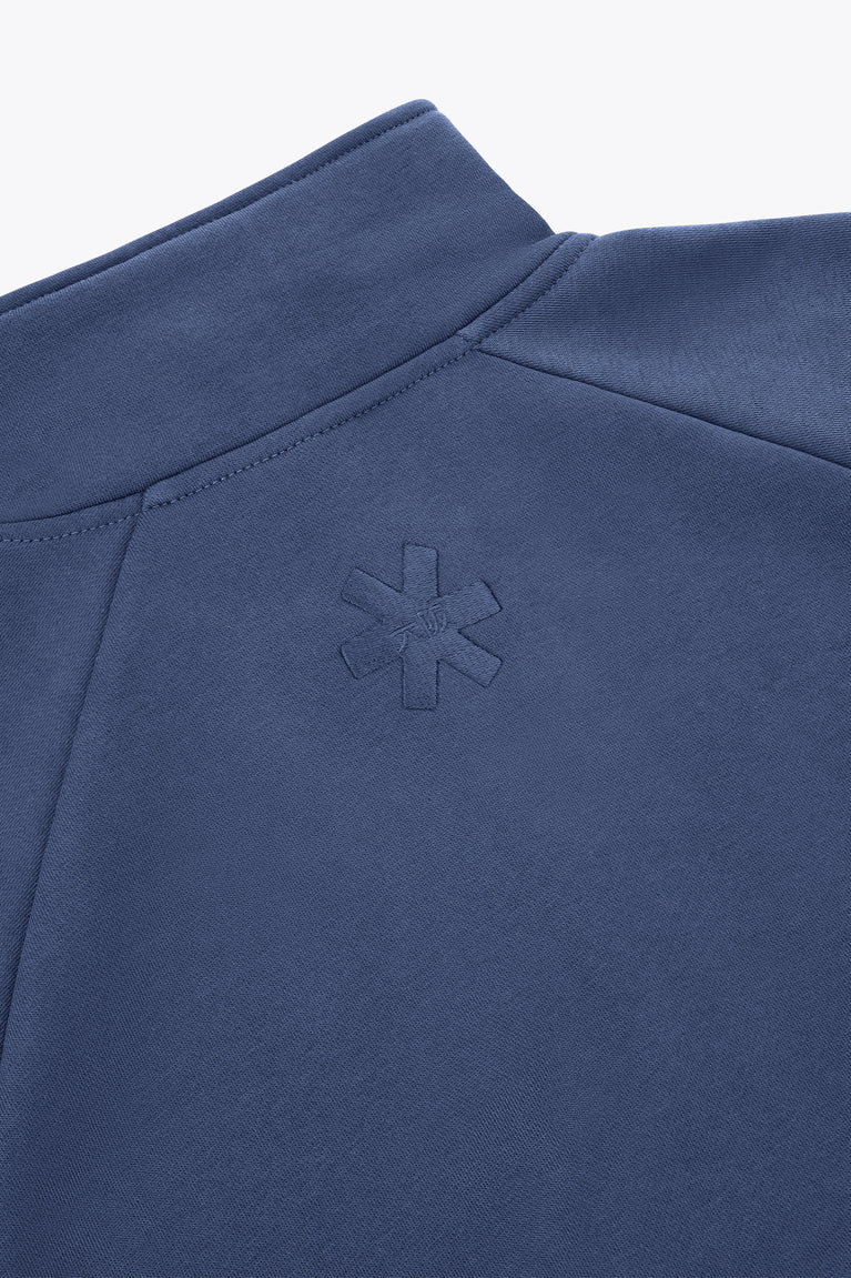 Women’s full-zip sweater back yoke close-up with small embossed emblem