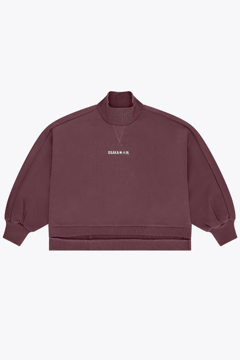 Women’s mockneck sweater in dark plum with small chest logo and relaxed sleeves