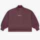 Women’s mockneck sweater in dark plum with small chest logo and relaxed sleeves