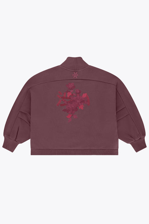 Women’s mockneck sweater in dark plum with small chest logo and relaxed sleeves