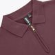 Women’s Osaka polo zip sweater close-up: ribbed collar, half-zip with metal pull, tag