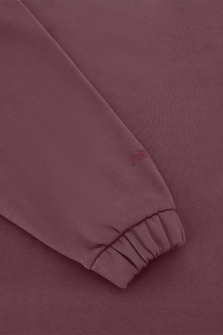 Women’s Osaka polo zip sweater close-up: ribbed cuffs and hem, peppercorn knit