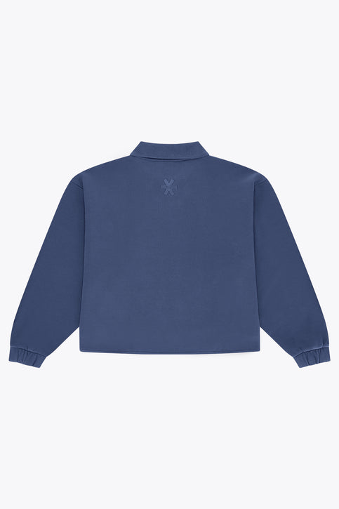 Blue women’s zip polo sweater with ribbed cuffs and hem, front quarter zip