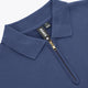 Blue women’s zip polo sweater close-up: flat collar and quarter-zip with gold pull