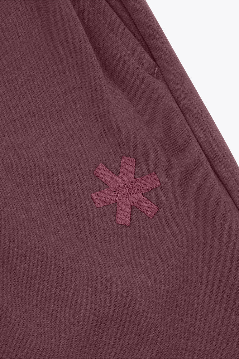 Plum wide-leg sweatpants with embroidered cross logo on the leg