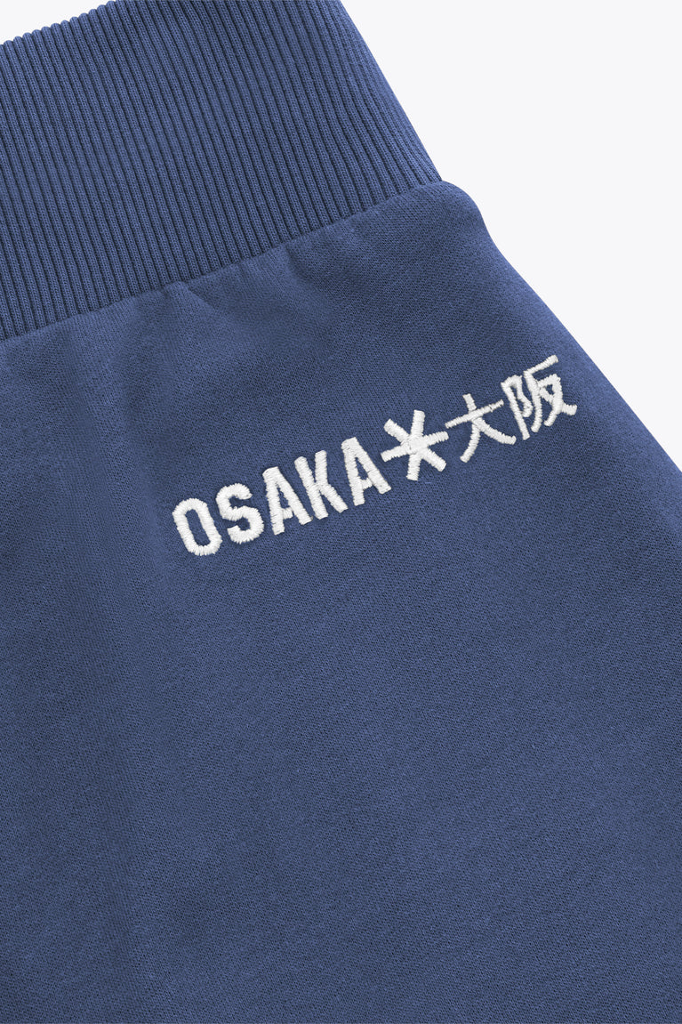 Dark blue sweatpants with OSAKA and Japanese text logo on the waistband hem