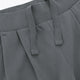 Close-up of grey ribbed waistband and drawstring detail on wide-leg sweatpants