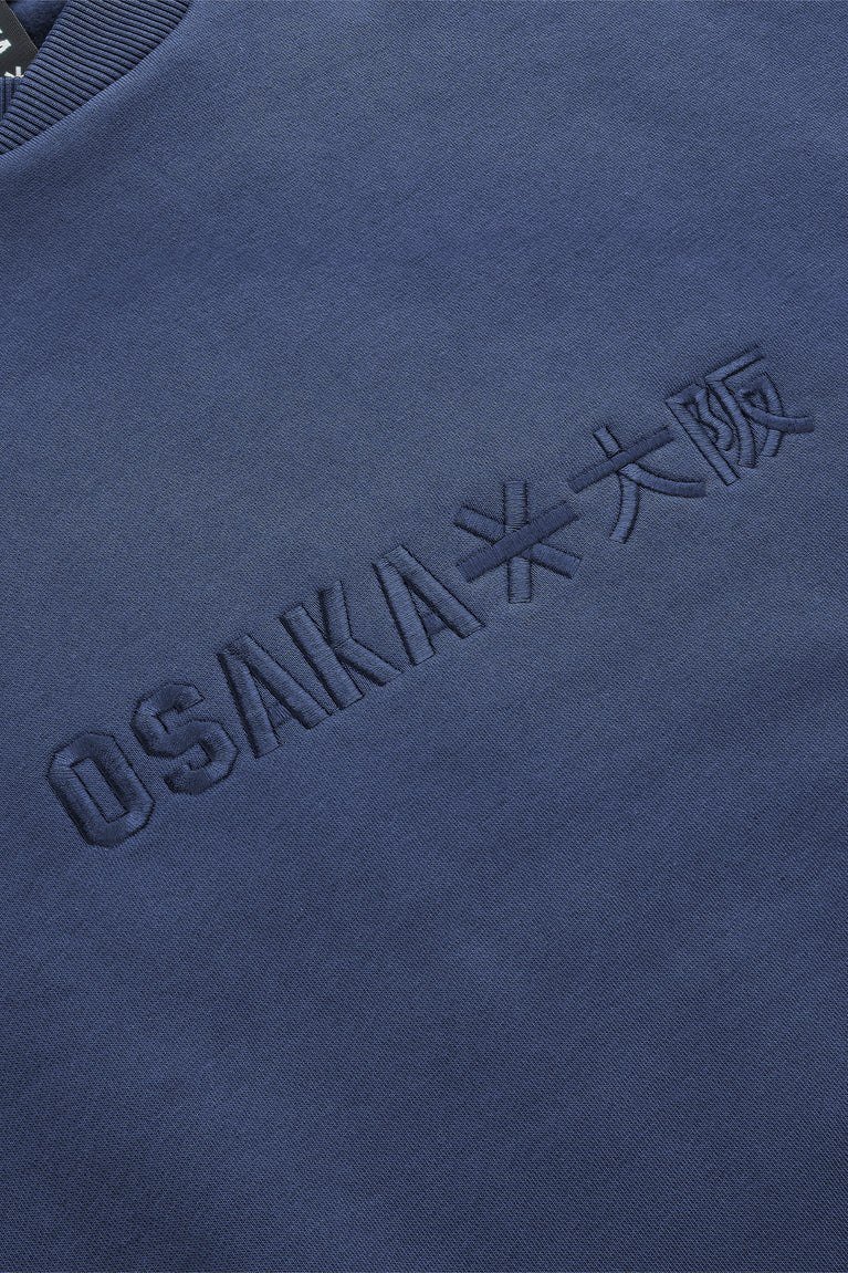 Dark blue Osaka sweater with embroidered logo across chest