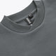 Dark grey sweater neckline with ribbed crew collar and inner logo tag
