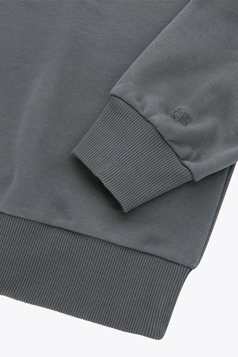 Dark grey melange sweater sleeve with ribbed cuff and embroidered logo