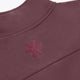 Men's Peppercorn half-zip sweater top view of embroidered collar logo