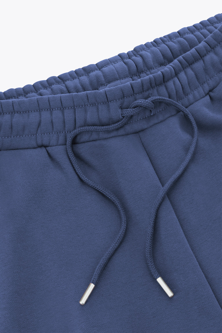 Blue sweatpants waistband with elastic and drawstring cords