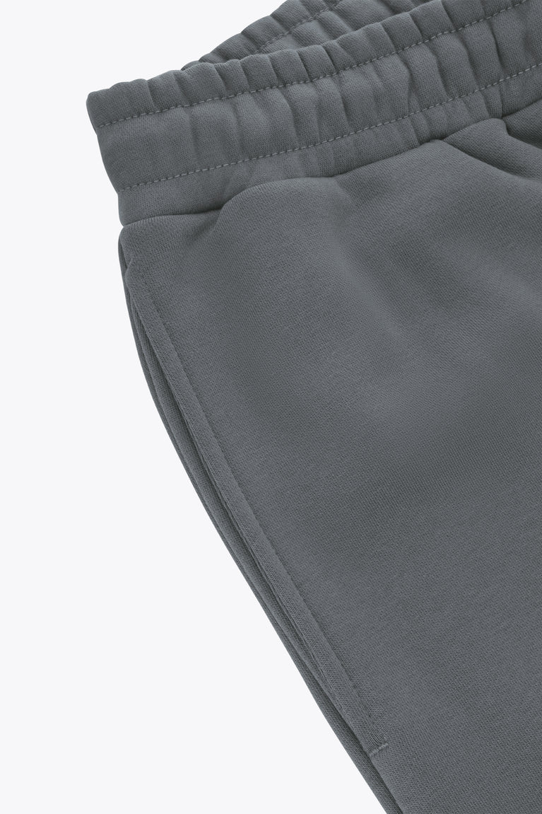Dark grey melange sweatpants leg with side seam and elasticized waistband.