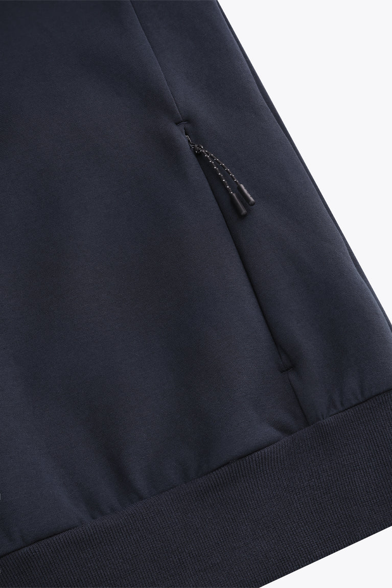 Navy unisex knit hoodie sleeve detail with drawstring and reinforced pocket seam