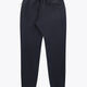 Navy unisex sweatpants with elastic waistband, front pocket seam, and cuffs
