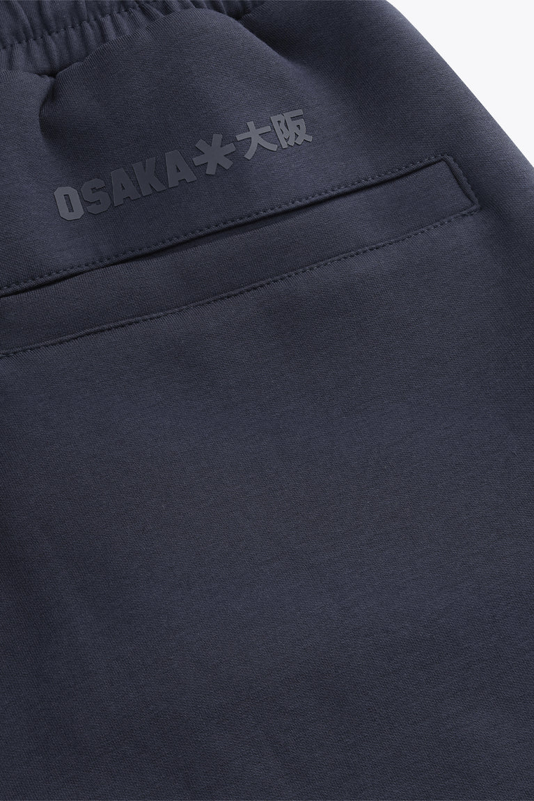 Navy sweatpants waistband with embroidered logo patch