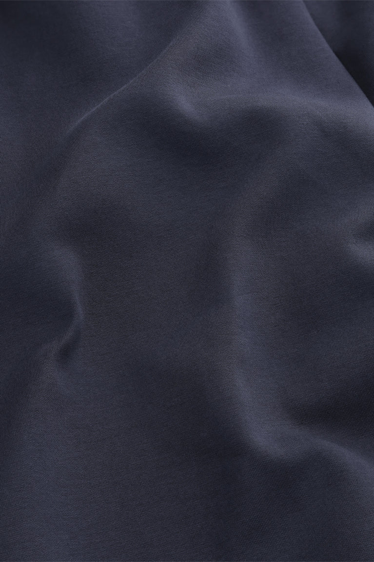 Navy knit sweatpants fabric close-up