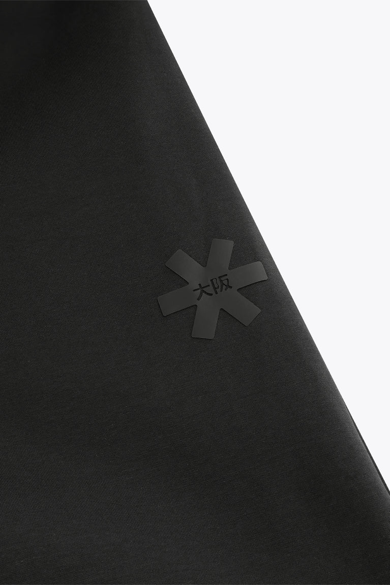 Black neo-knit fabric panel with subtle embossed logo
