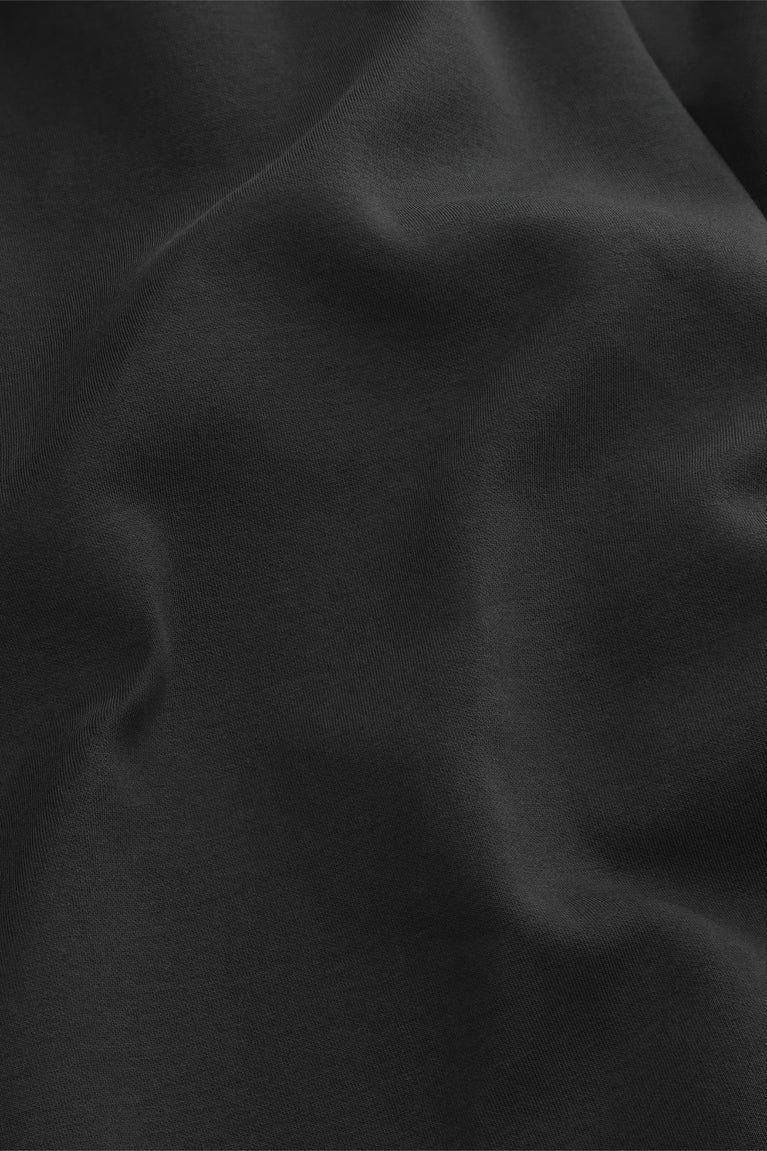 Black sweatpants fabric with smooth matte texture