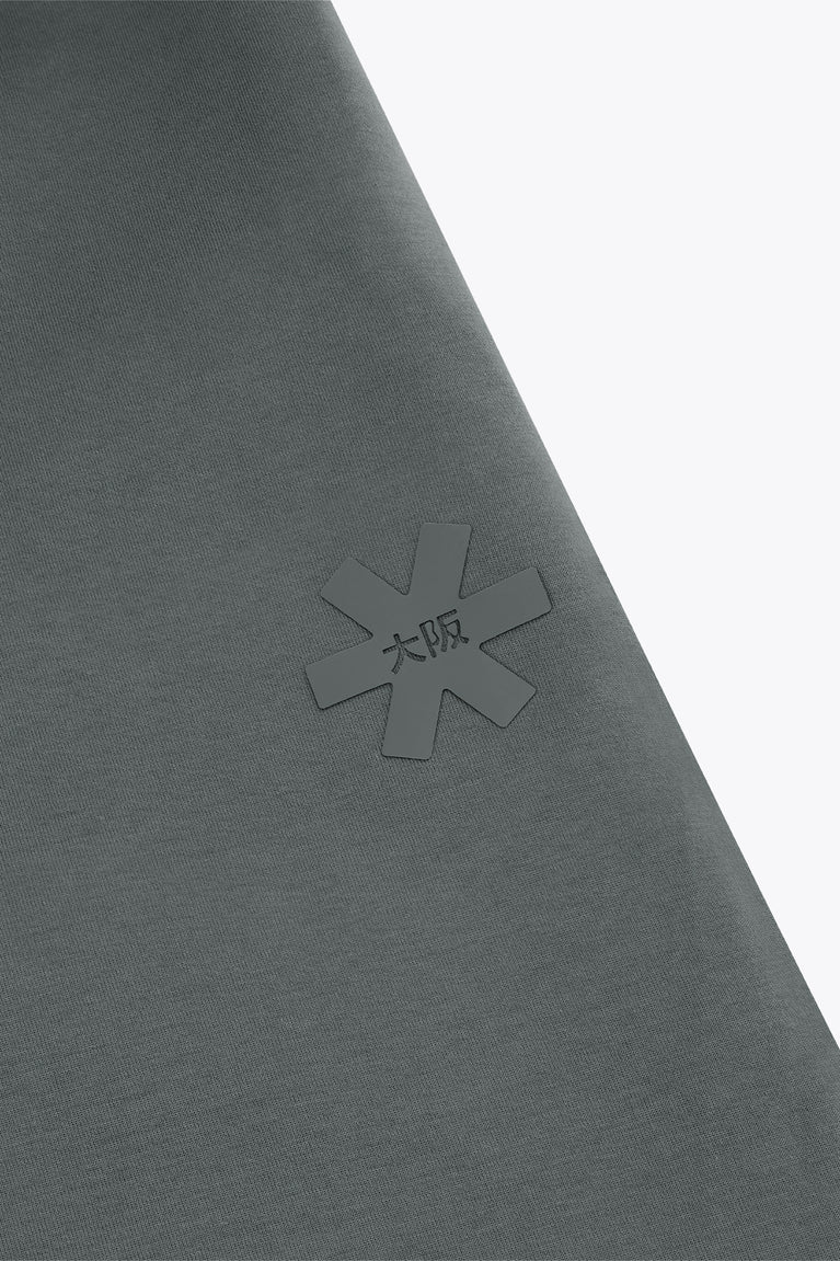 Dark grey sweatpants with subtle cross logo on the leg