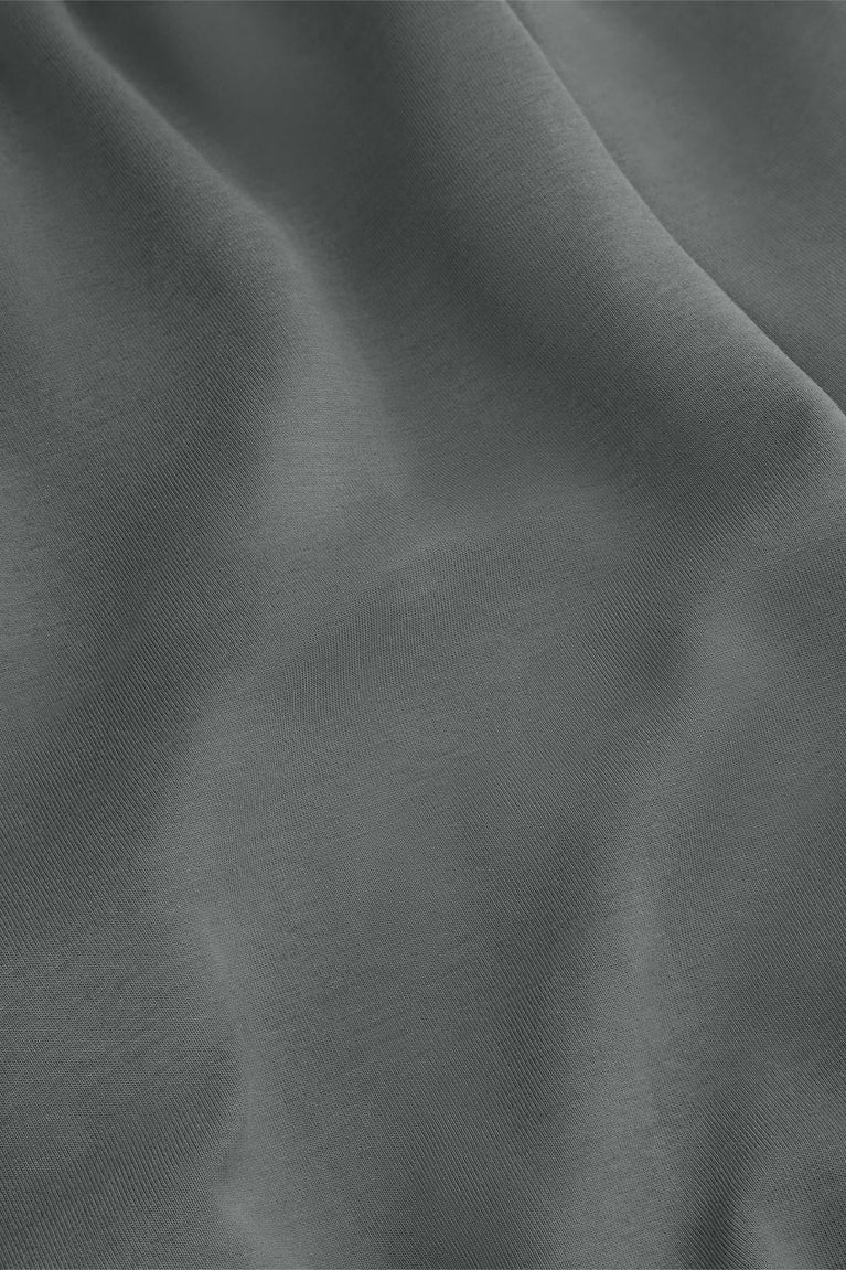 Close-up of dark grey sweatpants knit fabric texture