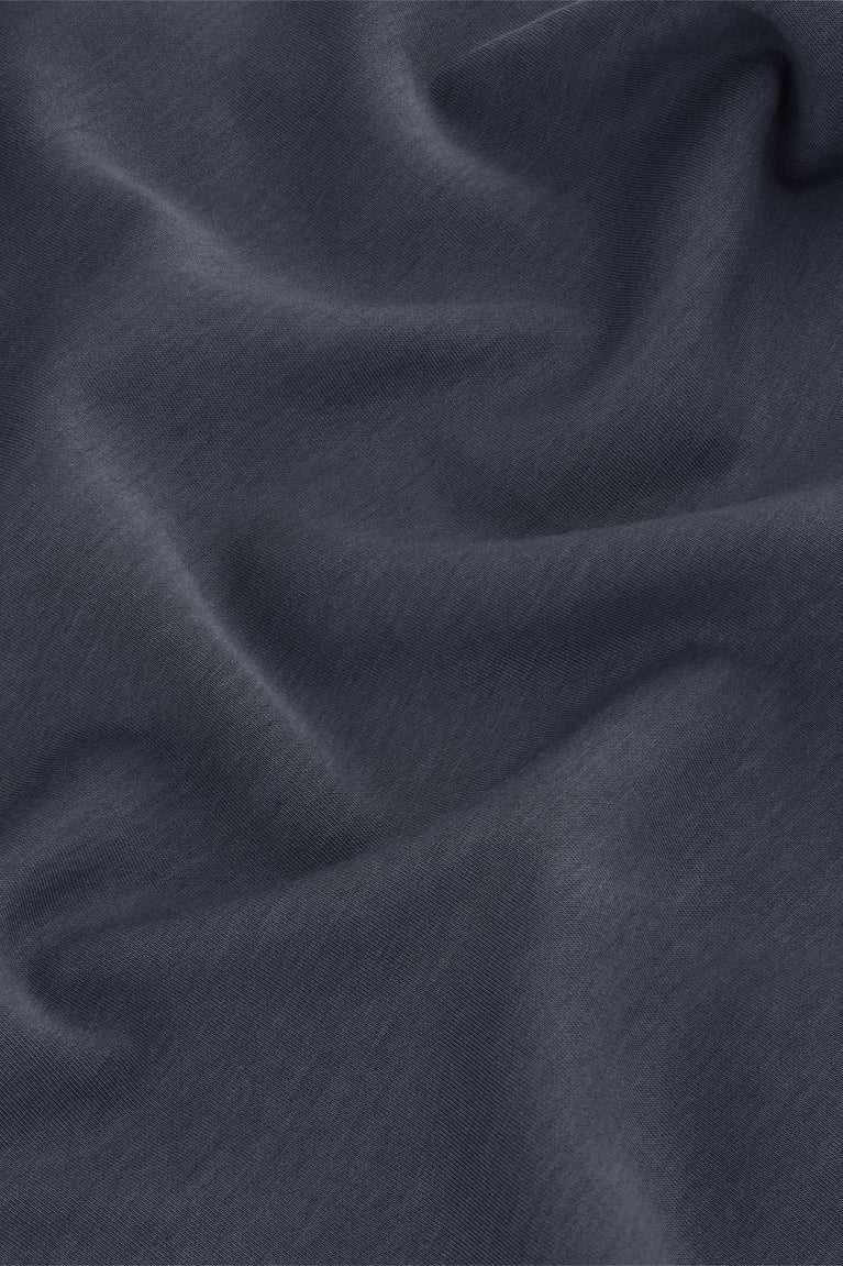 Navy unisex boxy tee fabric close-up showing smooth knit texture