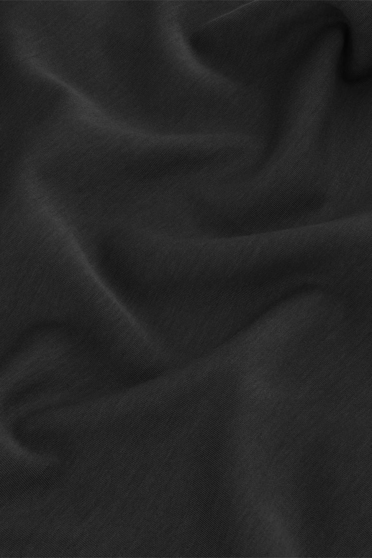 Black T-shirt fabric close-up with smooth knit texture