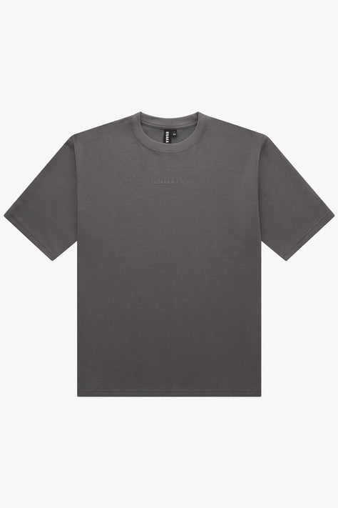 Dark grey unisex boxy T-shirt with crew neck and small front logo