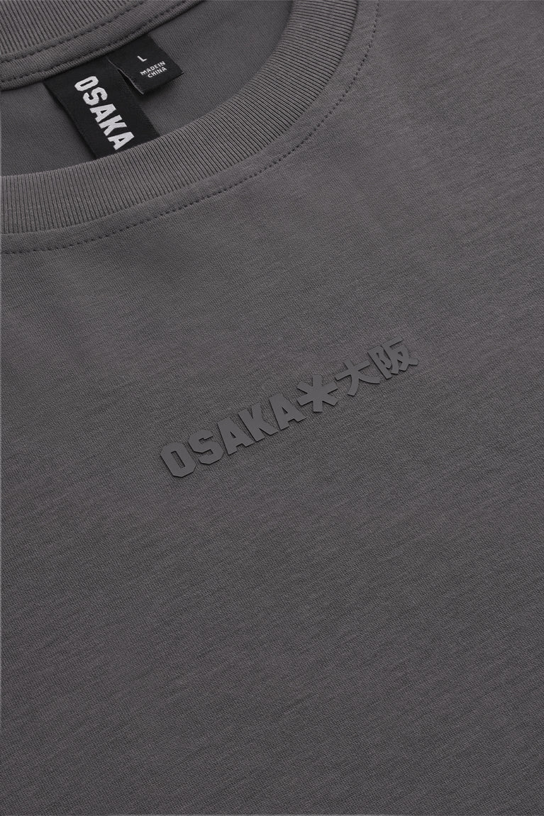 Dark grey boxy T-shirt neckline label and embroidered chest logo detail