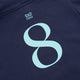 Kids deep sea navy hoodie close-up: mint Yibbi logo graphic and hood seam stitching.
