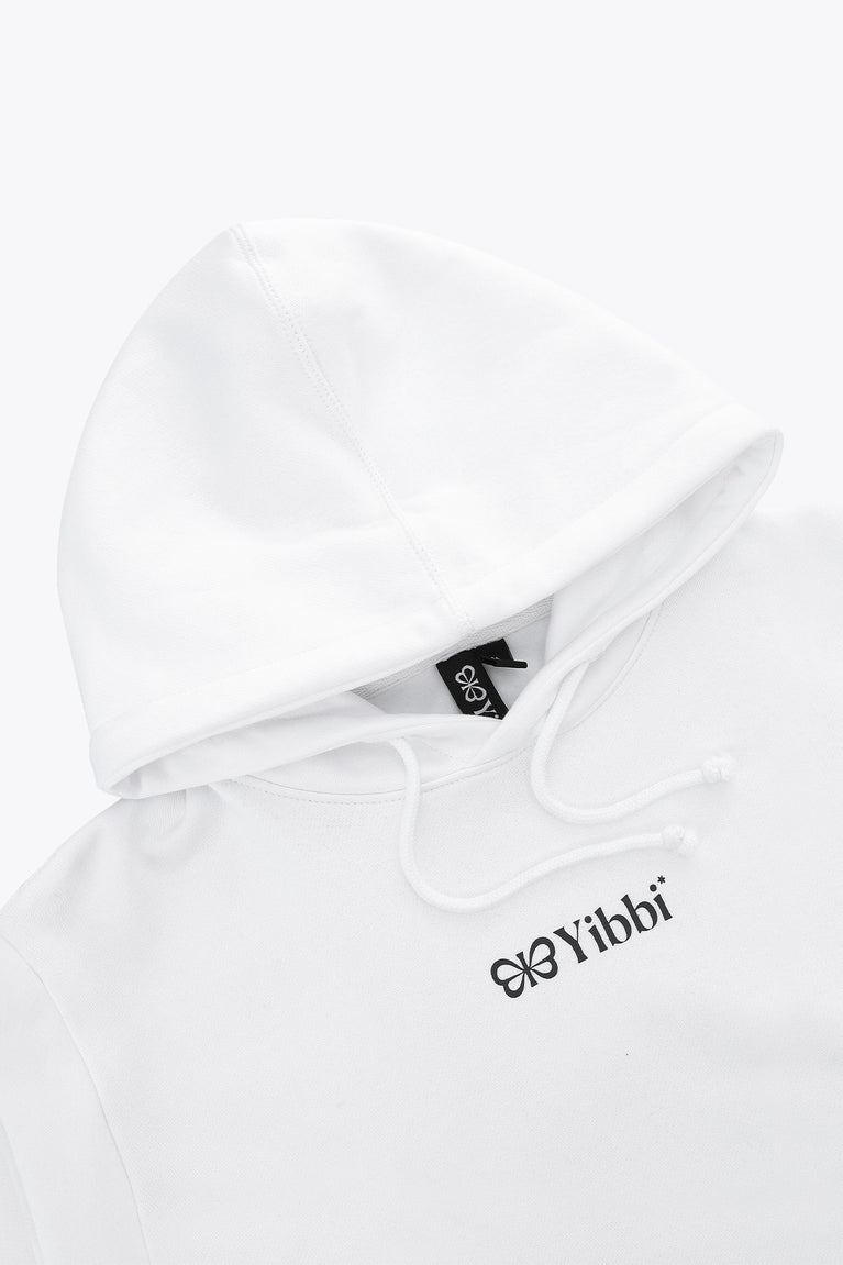 White hoodie close up with drawstring hood and Yibbi chest logo