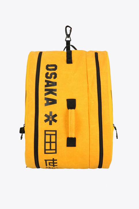 Pro Tour padel bag in honey comb with logo in black. Side view