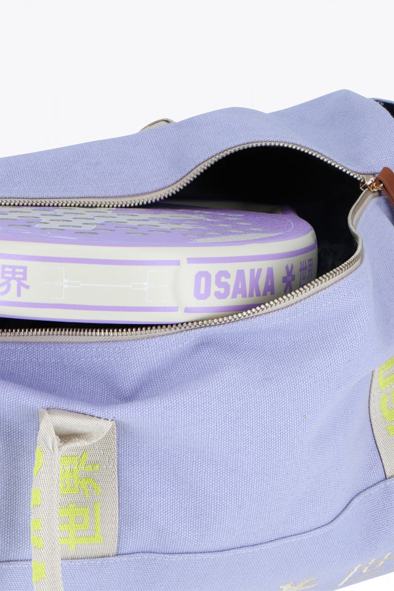 Osaka cotton duffel in light purple with logo. Front detail zipper view