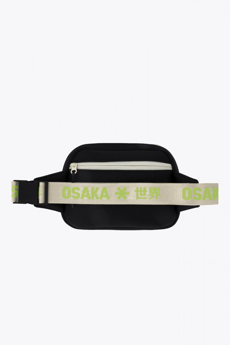 Osaka neoprene belt bag in black with logo in green on the belt . Back view