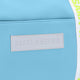 Osaka neoprene duffel bag in light blue with logo in white on the bag and in green on the straps. Detail logo view