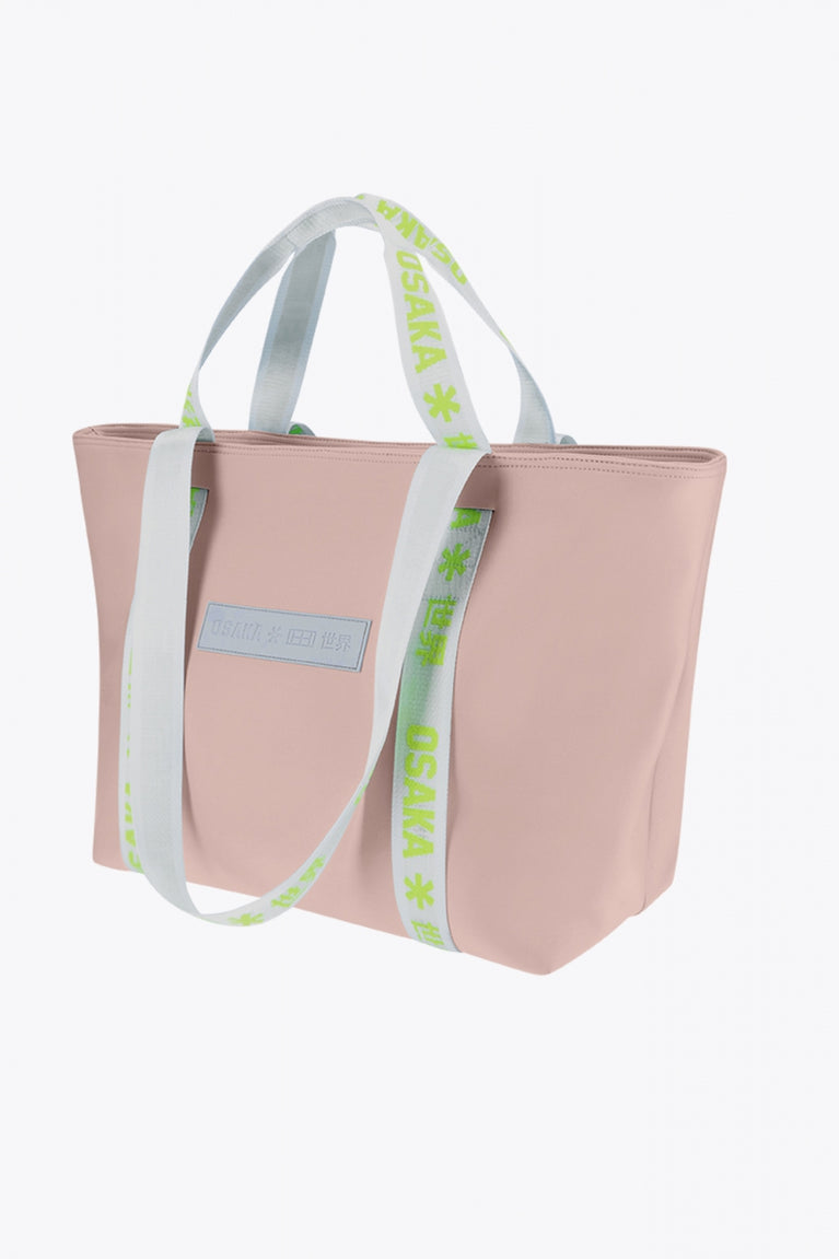Osaka neoprene Tote bag in powder pink with logo in white. Front view