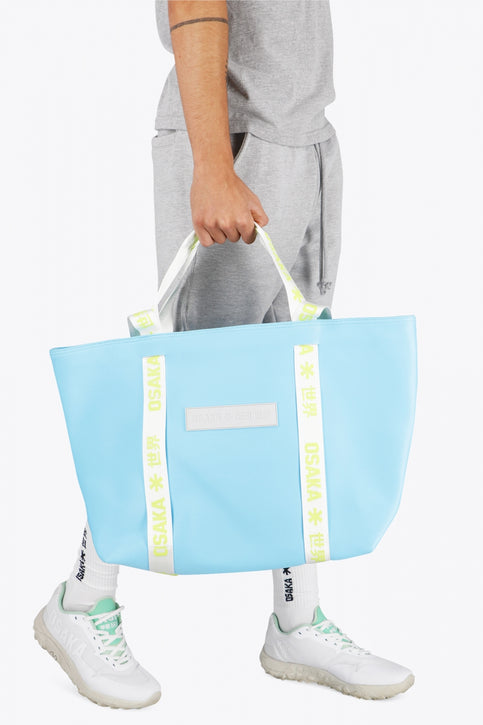 Osaka neoprene Tote bag in light blue with logo in white. Front view