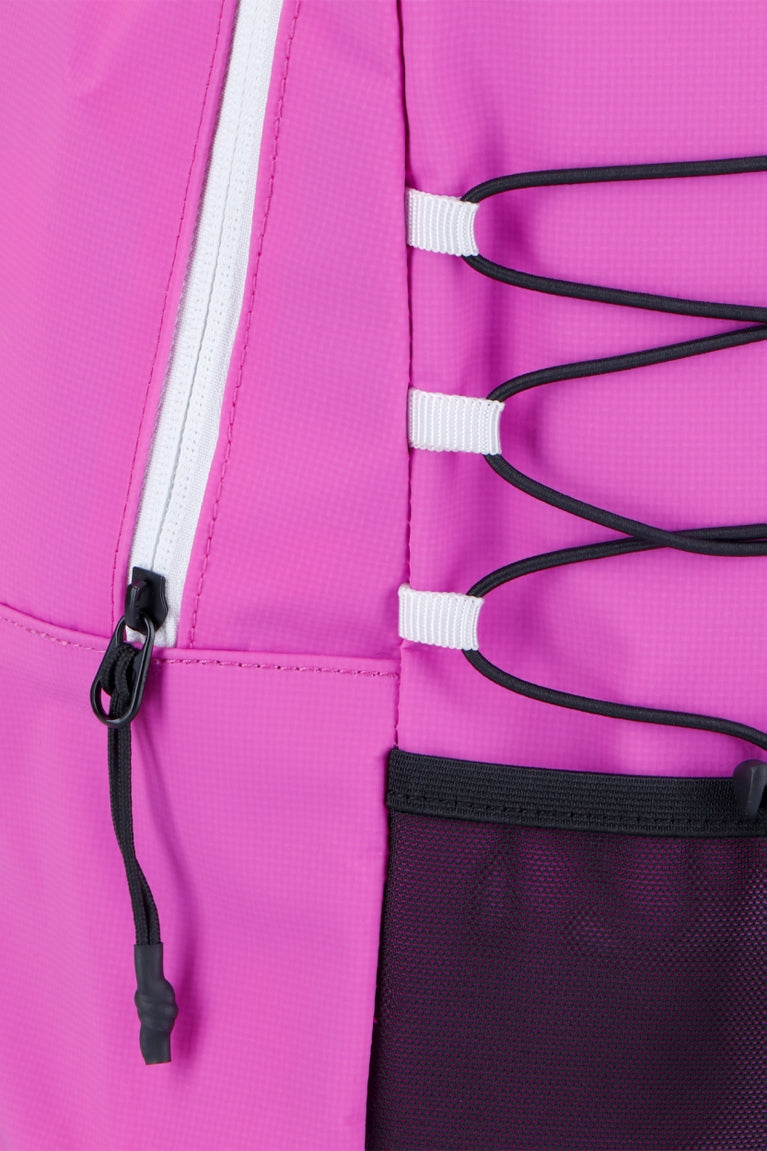 Osaka pro tour compact backpack in pink with logo in white. Detail zip view