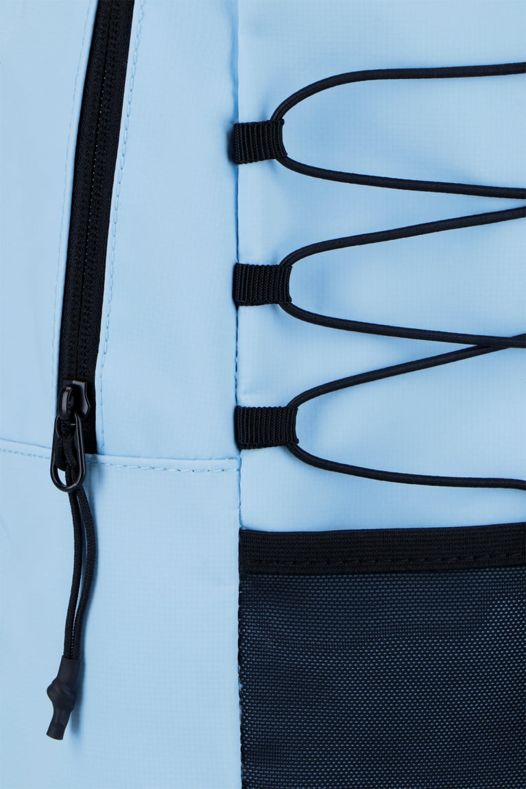 Osaka pro tour compact backpack in light blue with logo in black. Detail zip view