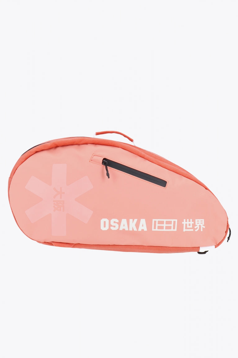 Pro Tour padel bag in peach with logo in white. Side view