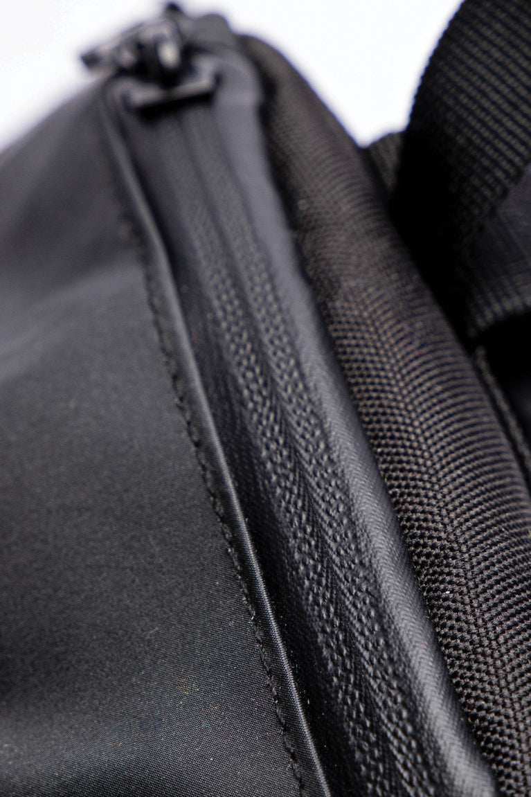 Osaka x Nexus backpack medium in black with white Osaka and Nexus logo on it. Detail zip view