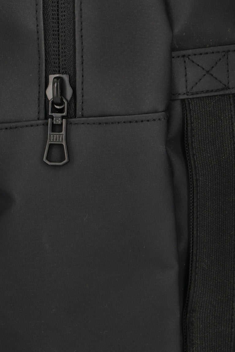 Osaka pro tour compact backpack in black with logo in green. Detail zip view