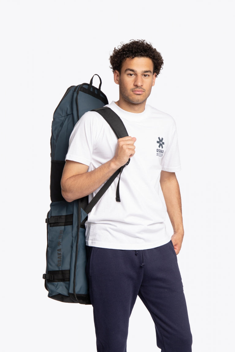 Osaka Hockey Stickbag Pro Tour large in Navy with logo in black. Model wearing view